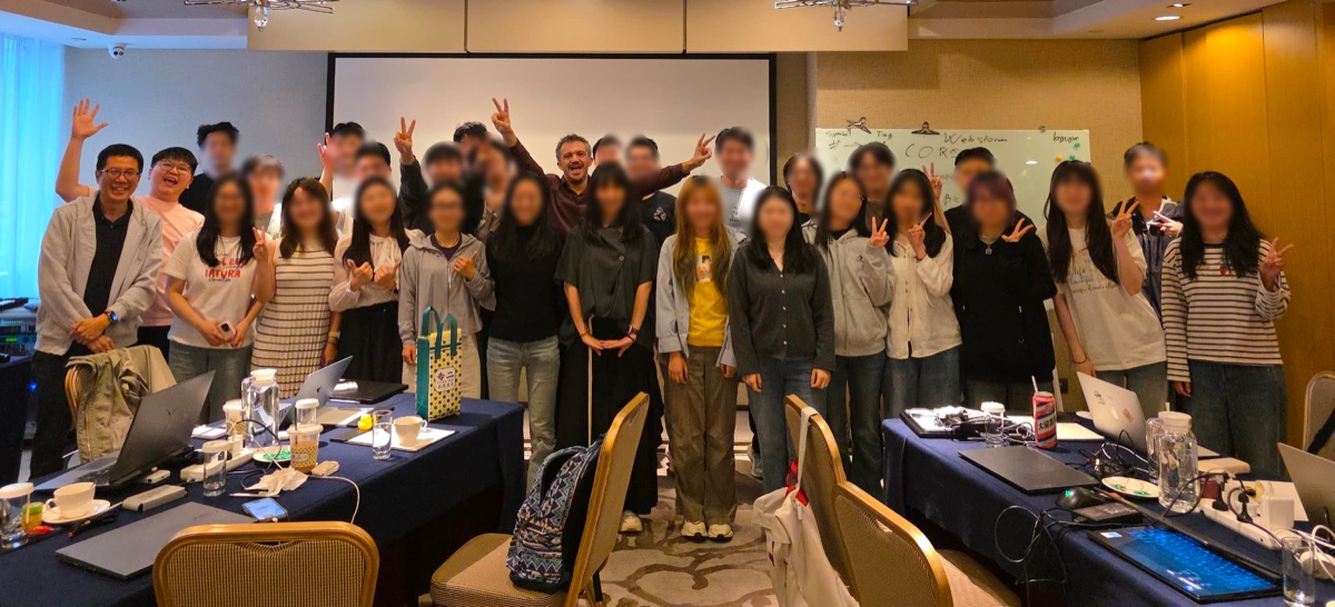Training session group photo in a conference room in Asia