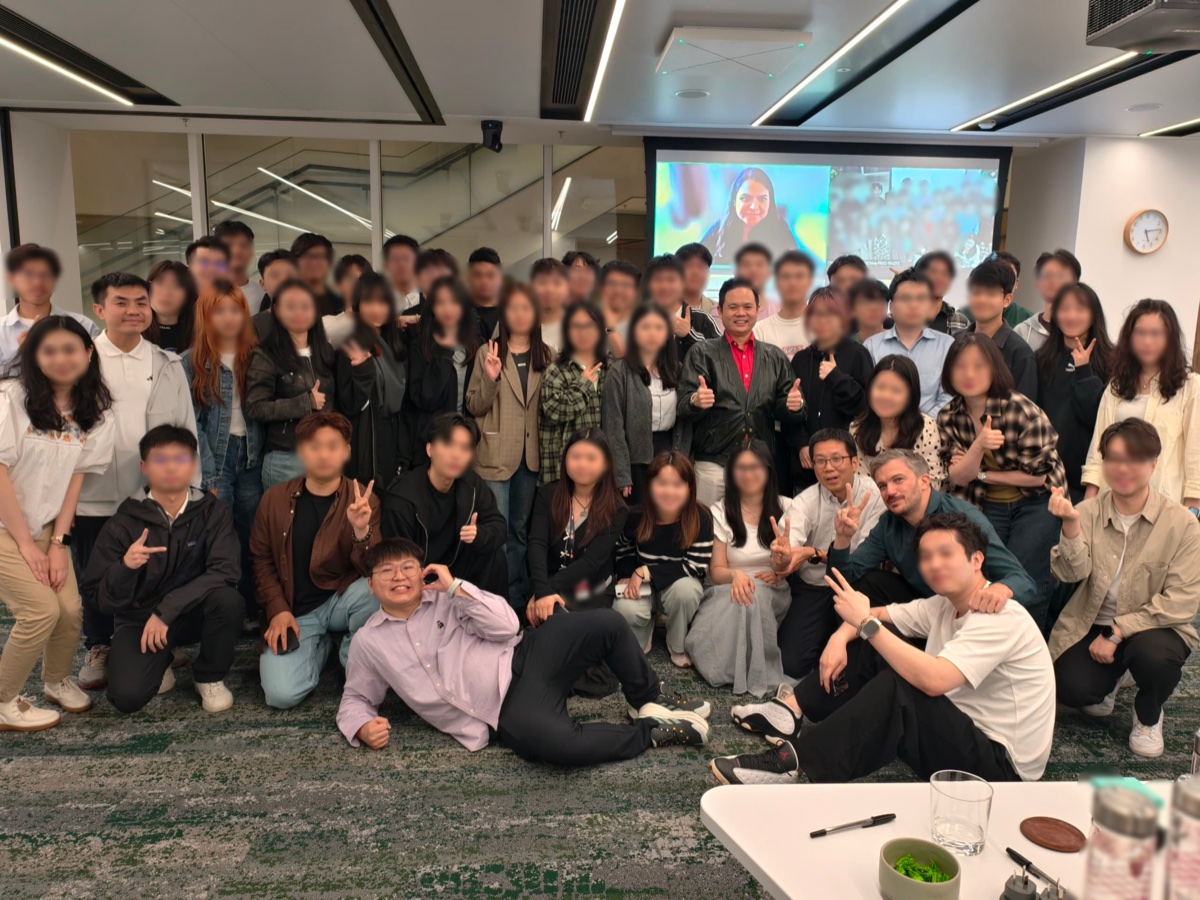 Large group training session with 50+ participants in Asia